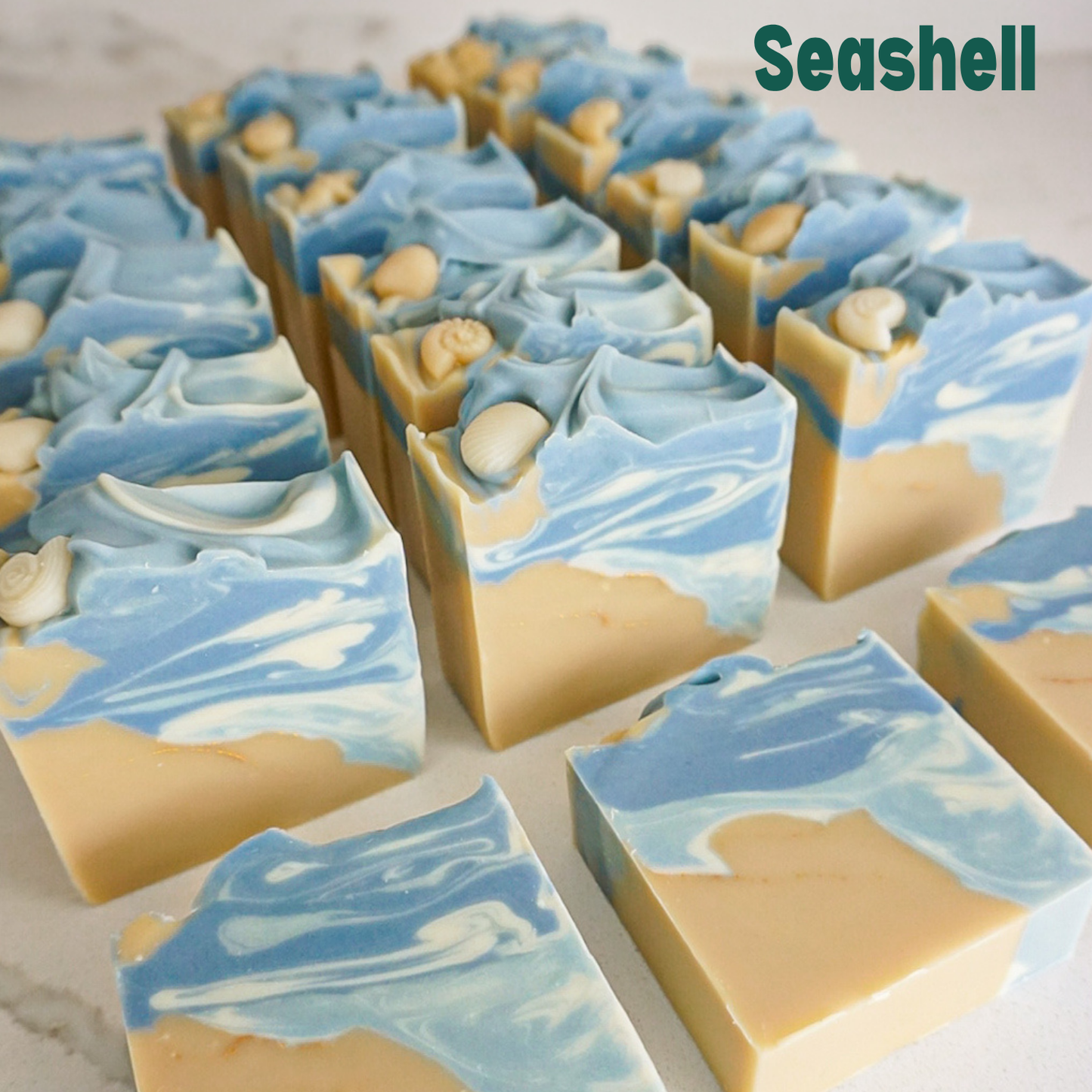 Marble-patterned soap bars with blue and beige colors on a light background, labeled 'Seashell'.