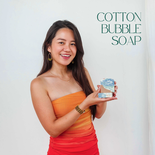 A girl holding 2 soaps in a orange dress and Cotton Bubble Soap written on the picture profile