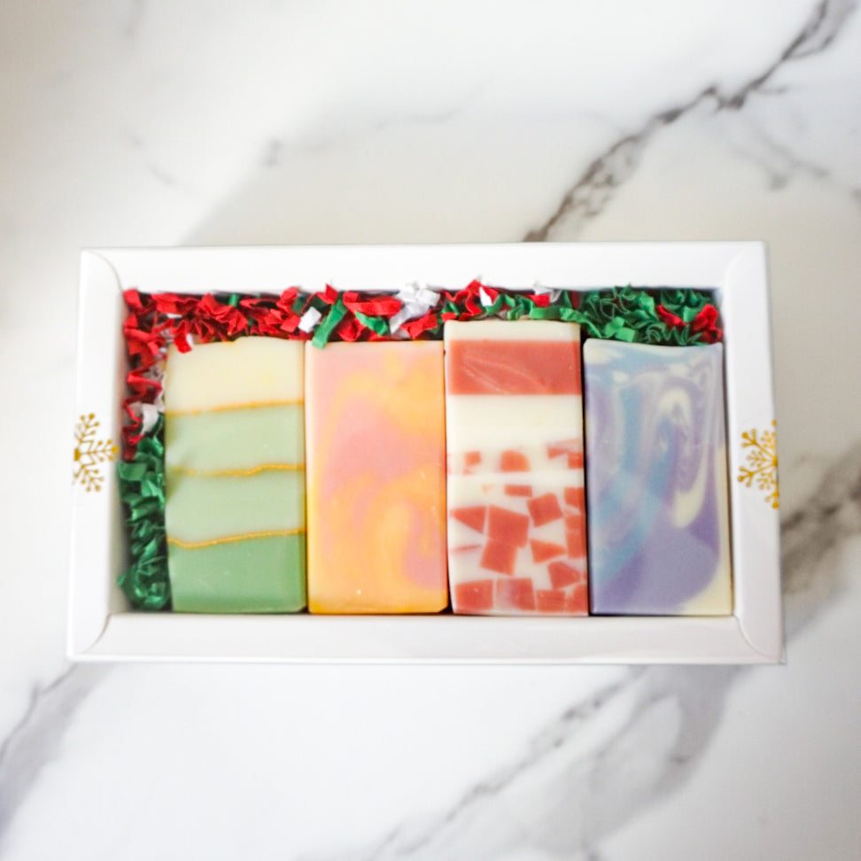 4 colorful soaps in a white gift box