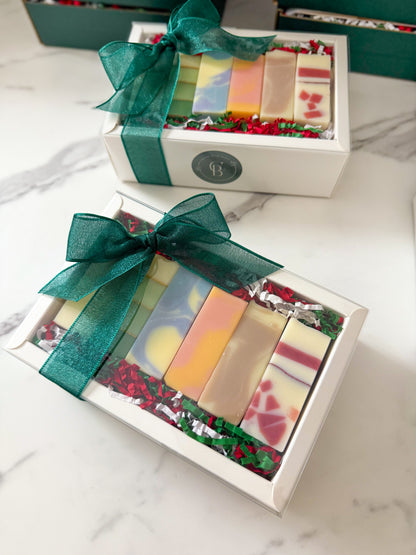 6 colorful soaps in a white gift box with a green bow