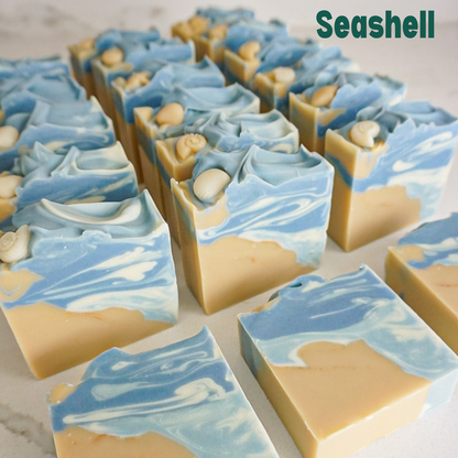 Marble-patterned soap bars with blue and beige colors on a light background, labeled 'Seashell'.