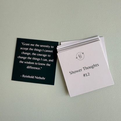 one card with a quote and a stack of cards with text on a light gray background