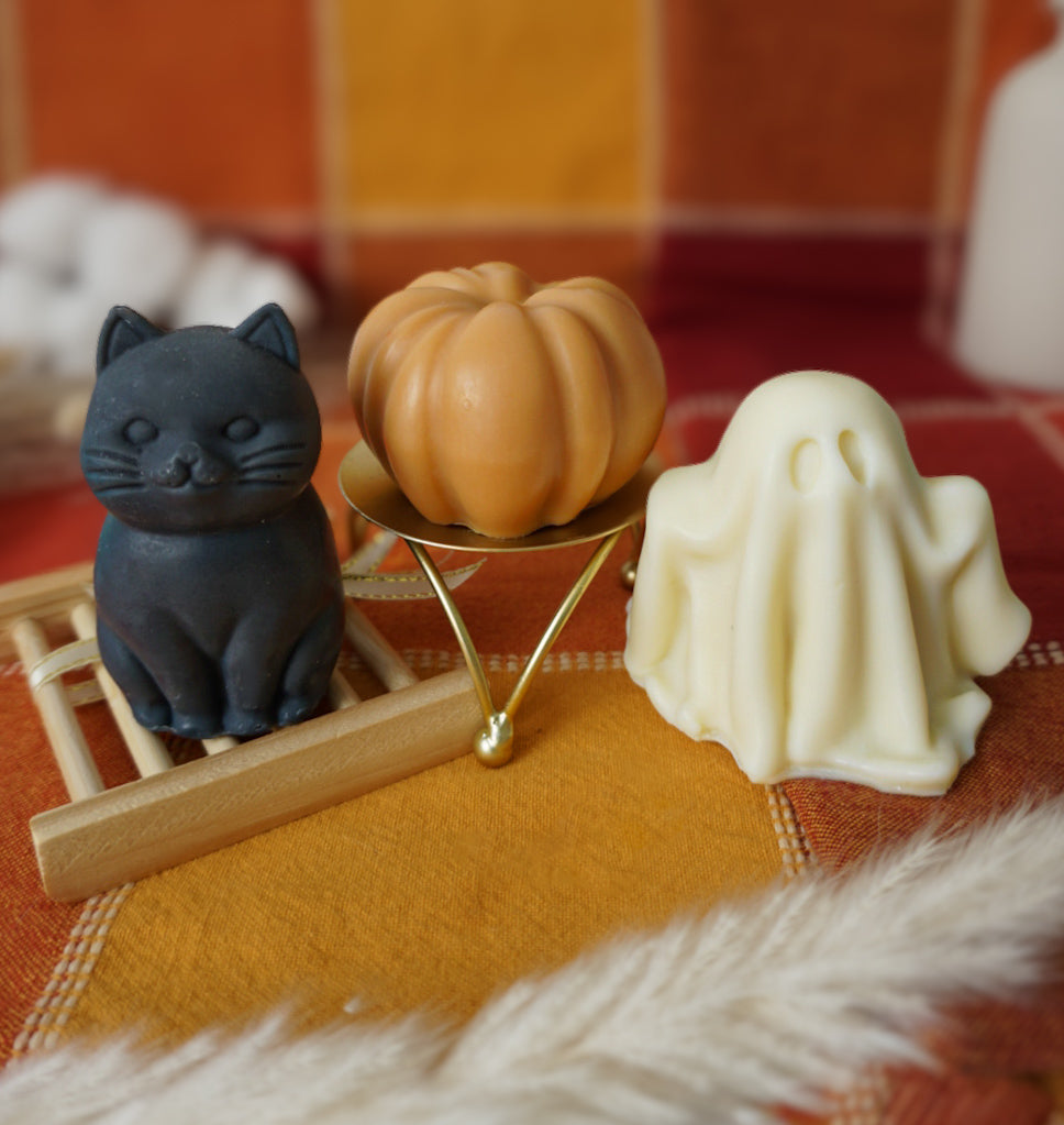 cat soap ghost soap and pumpking soap on an orange checkered fabric background