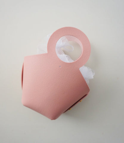 Pink gift bag on a white background