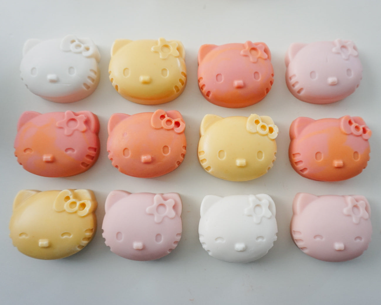 Row of Hello Kitty-themed soaps on a light gray background