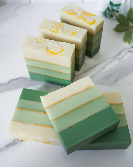 Green layered soap bars on a marble surface