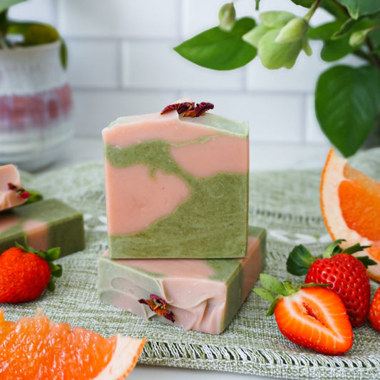 This strawberry matcha soap is scented with grapefruit and strawberry, and colored with rose clay and wheatgrass.