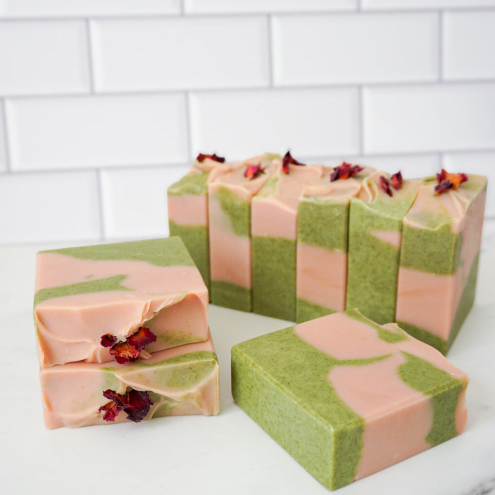 This strawberry matcha soap is scented with grapefruit and strawberry, and colored with rose clay and wheatgrass.