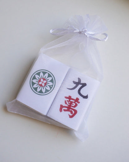 Product packaging with a brand logo and text on a light background